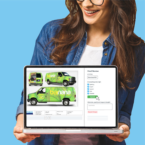 woman holding computer with custom van