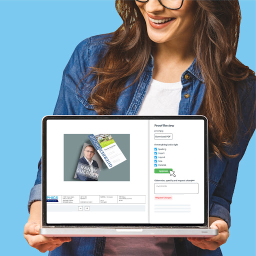 woman holding laptop showing proofing process