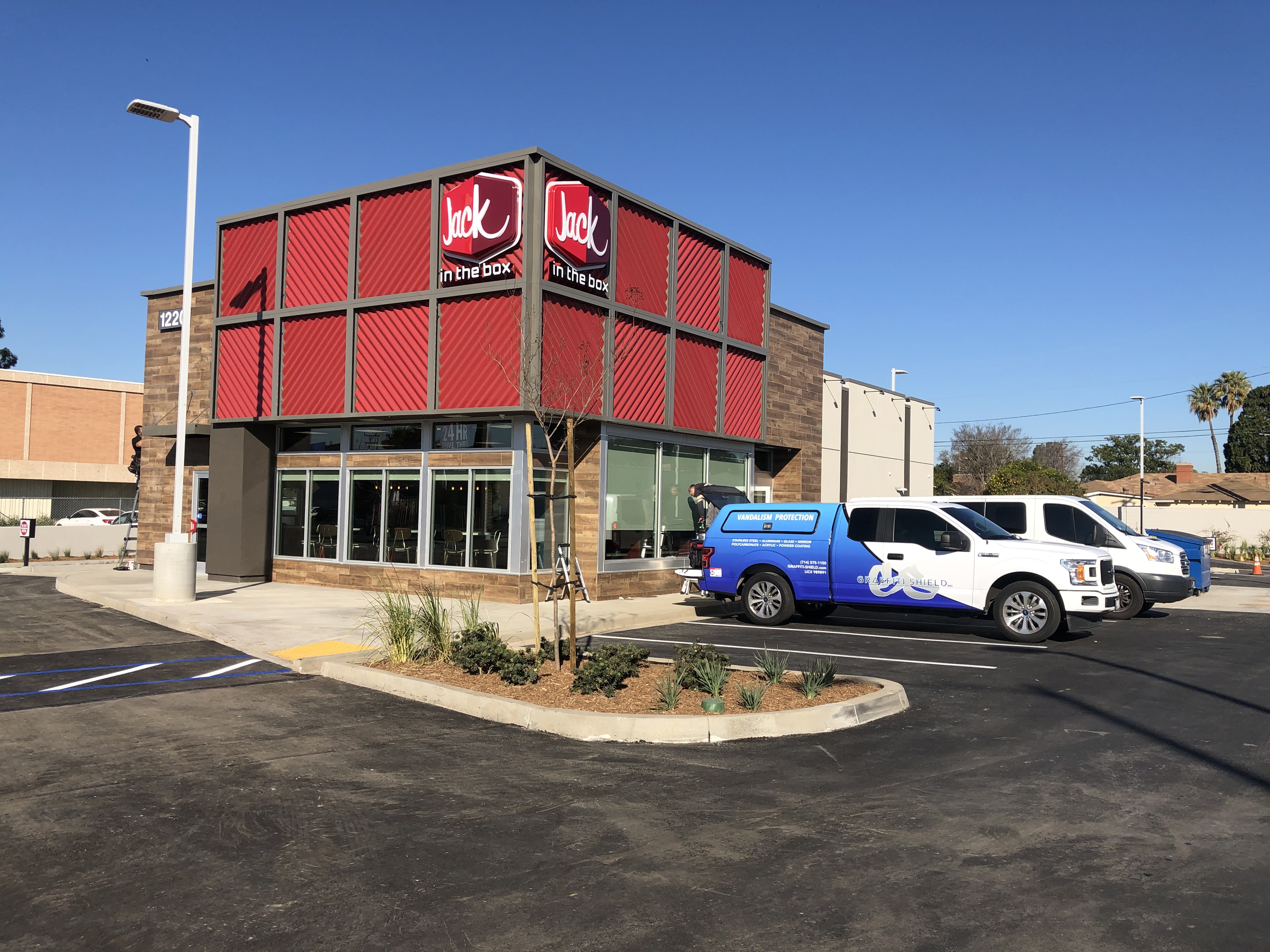 Graffiti Shield on the windows of a Jack in the Box restaurant