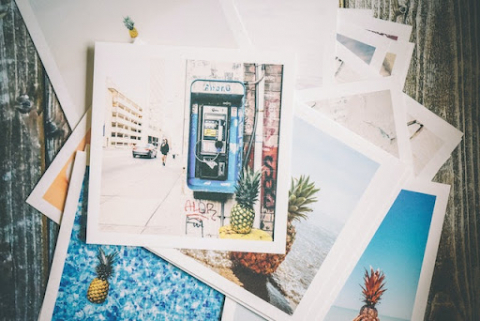 A group of prints sit on the floor.