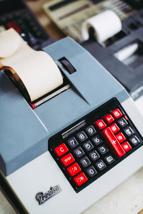 Old calculator with paper spool.