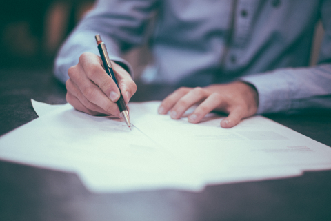 Man reviewing papers.